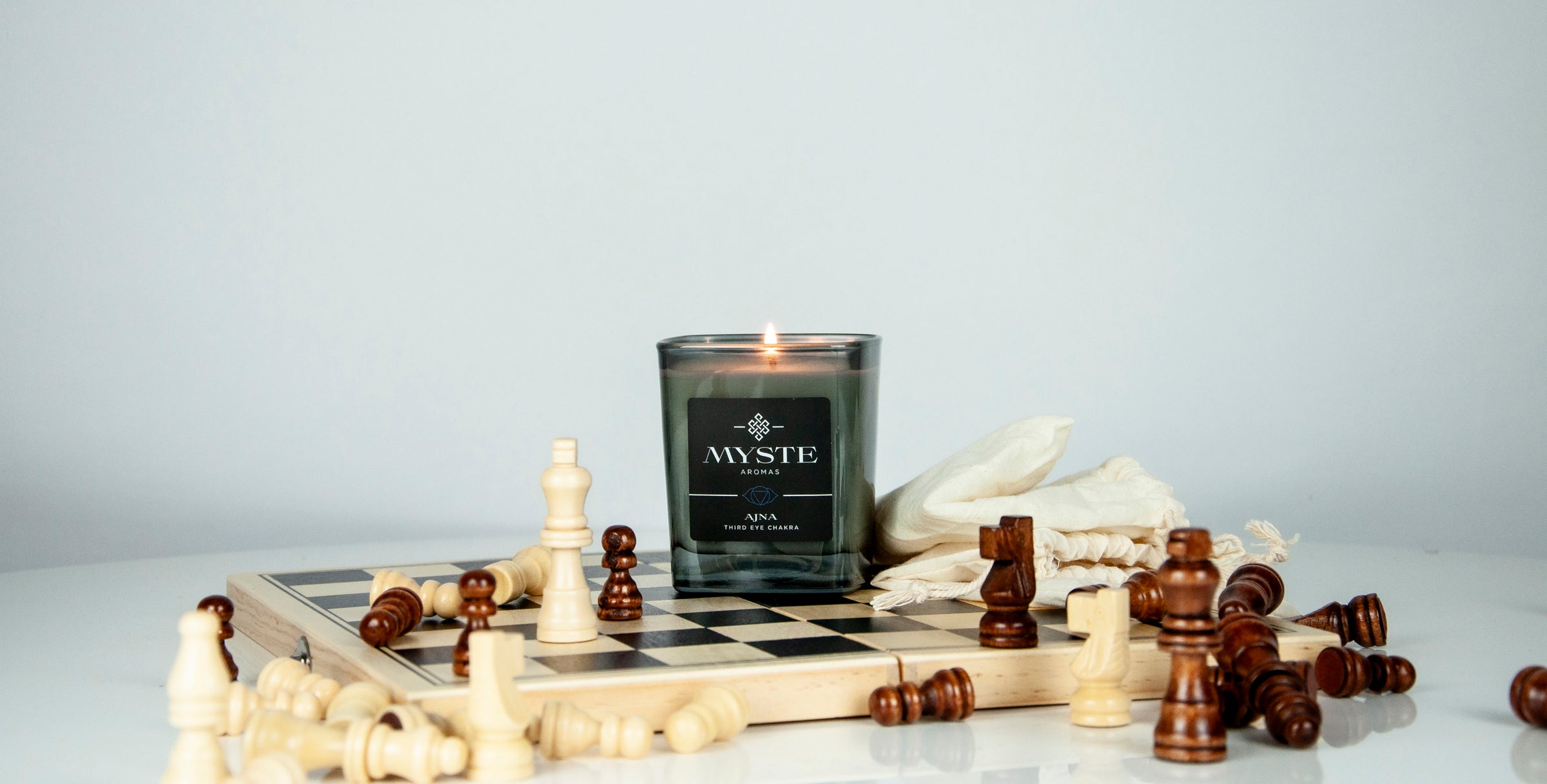 scented candle on chess board